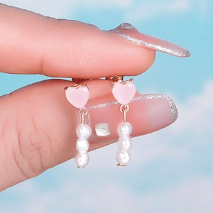 Pink heart earrings with three vertical pearls on rose gold stainless steel base
