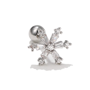 Macro view of snowflake earring with sparkling cubic zirconia and screw-back ball detail