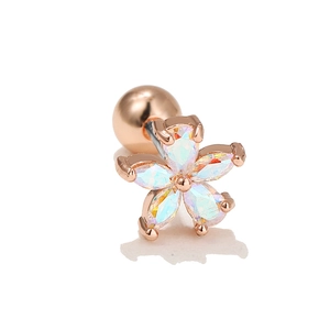Detail of rose gold flower cartilage stud with five-petal iridescent opal stones