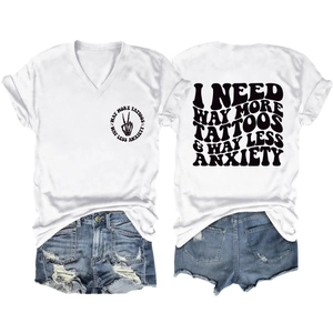 Detail of white V-neck T-shirt back print and distressed denim shorts set