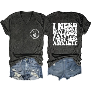 Detail view of V-neck grey tee with artistic back print and distressed denim shorts