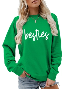 Detail of green crewneck sweatshirt with white besties print and gold necklace accessory