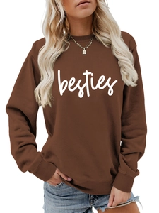 Close-up of Besties letter print on brown crewneck sweatshirt with ribbed cuffs and hem