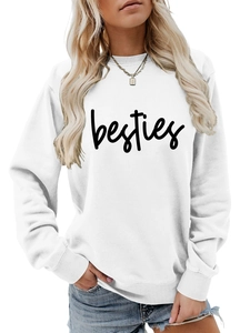 Detail of white crewneck sweatshirt with black handwritten besties lettering and ribbed cuffs