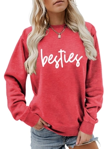 Close-up of Besties script print on a red crewneck sweatshirt with ribbed cuffs