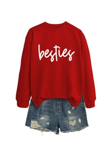 Detail of red crewneck sweatshirt with white besties text and distressed denim shorts