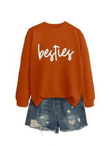 Orange BESTIES sweatshirt with blue distressed denim shorts set on white background