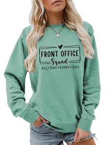 Detail of the ribbed crewneck and front office squad graphic on mint green sweatshirt