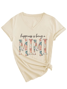 Detail of V-neck beige T-shirt with floral Mimi print and stylish front knot hem