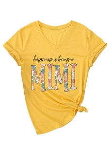 Detail of V-neck short sleeve ginger t-shirt with knotted hem and floral MIMI print