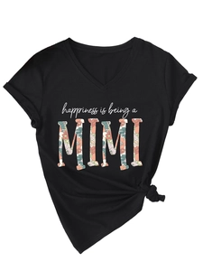 Detail of V-neck black T-shirt featuring happiness is being a MIMI floral print and side knot