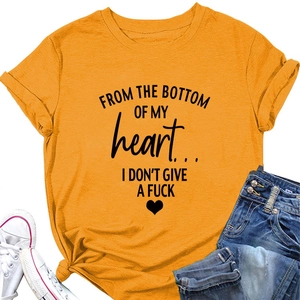 Close-up of heart slogan print on yellow short sleeve t-shirt with lifestyle flat lay