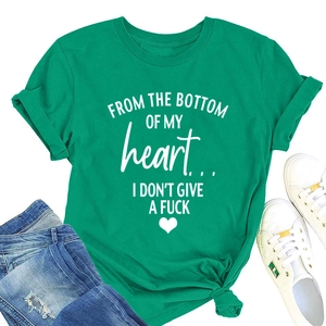 Flat lay of green cotton t-shirt with heart graphic paired with ripped blue jeans