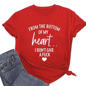 Detail of red cotton T-shirt featuring white slogan print and stylish front hem knot