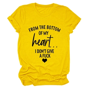 Detail of minimalist ginger yellow cotton T-shirt with black letter print and heart graphic