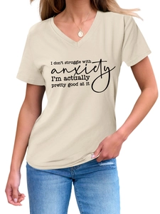 Detail of V-neck short sleeve tee in beige with printed slogan and necklace accent