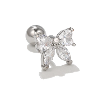Detail of a bow ear stud with heart-shaped cubic zirconia and a screw-back ball closure