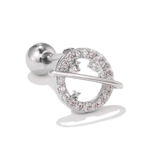 Macro detail of planet-shaped cartilage stud with pavé cubic zirconia and star cutout