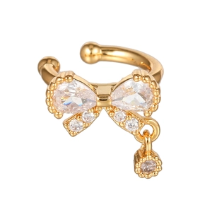Detail of 18K gold butterfly ear cuff featuring sparkling pear-shaped zircon stones