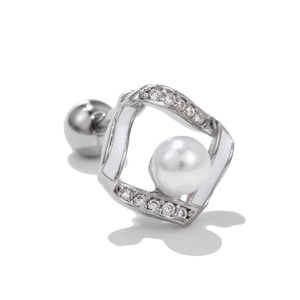 Detailed view of silver bow-style stud earrings with white enamel and centered pearl accent