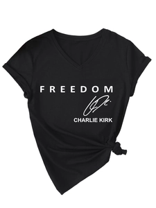Detail of Charlie Kirk Freedom print on black cotton V-neck tee with knotted hem