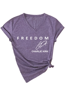 Detail of purple V-neck T-shirt with Freedom Charlie Kirk print and side knot detail