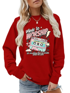 Detail of red crewneck sweatshirt featuring retro cassette and psalm print for women