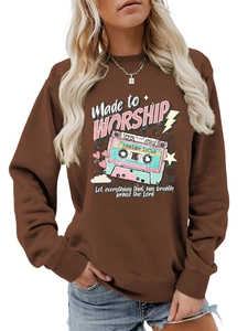 Detail of retro cassette tape graphic and Made to Worship text on brown sweatshirt