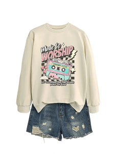 Detail of beige sweatshirt featuring a vintage cassette graphic and Worship quote
