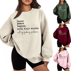Detail view of slogan print on thick casual sweatshirts in four autumn colors