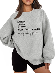 Close-up of Inner Peace slogan on thick grey crewneck sweatshirt with dropped shoulders