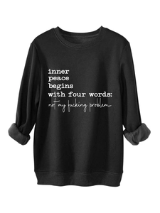 Detail of the thick grey fleece lining and funny slogan print on this black sweatshirt