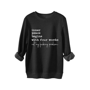 Thick black fleece sweatshirt featuring 'inner peace' quote print with rolled sleeves