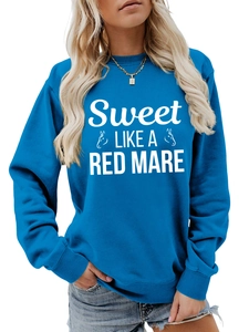 Detail of cobalt blue sweatshirt showing ribbed cuffs and Sweet LIKE A RED print