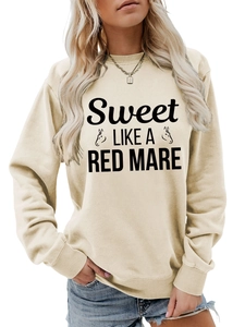 Detail of crewneck sweatshirt ribbing and Sweet Like A Red print on cream fabric