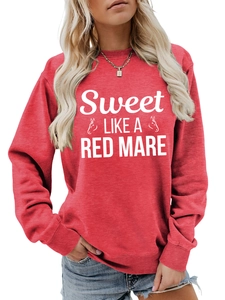 Detail of red crewneck sweatshirt featuring white horse graphic and Sweet Like a Red text