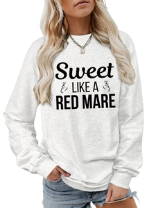 Detail of grey crewneck sweatshirt featuring Sweet Like A Red Mare text and horse graphics