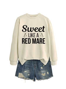 Close-up of crewneck sweatshirt with horse graphic and distressed denim shorts
