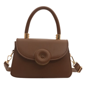 Brown faux leather crossbody bag with round lock and gold hardware on white background