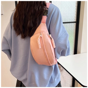 Detailed back view of pink nylon crescent waist bag with adjustable strap and buckle