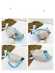 Detail view of plaid tweed waist bag showing adjustable strap and multi-angle layout