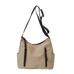 Minimalist khaki nylon crossbody messenger bag with adjustable strap and multiple zipper pockets