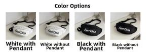Detail view of canvas waist bags in black and white with plush ball pendant and nylon strap