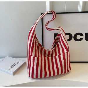 Chic red and white vertical striped canvas bucket shoulder bag with minimalist interior styling