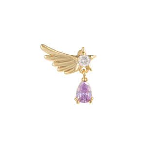 Detail of gold wing earring with purple pear-shaped gemstone and crystal star