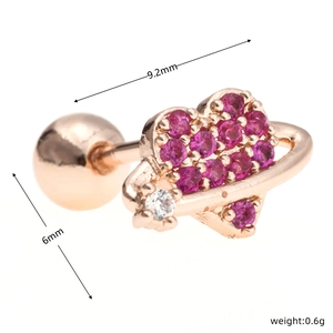 Macro detail of heart-shaped ear stud with pink stones and 9.2mm rose gold screw ball back