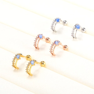 Three pairs of C-shaped screw back earrings in gold, silver, and rose gold with blue opal stones
