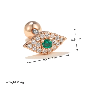 Macro view of rose gold Evil Eye stud earring with green zircon and screw ball back