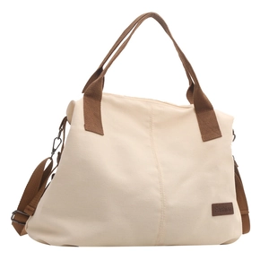 Large capacity beige canvas tote bag with brown straps and adjustable shoulder strap