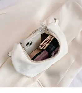 Top view of the interior compartment showing capacity for phone and cosmetics